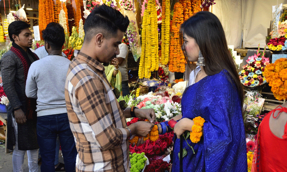 Teenagers thronged flower shops to buy flowers, floral gifts and boutiques to celebrate the Pahela Falgun and Valentine’s Day. Photo : Muktadir Mokto