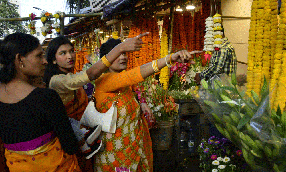 People thronged flower shops to buy flowers, floral gifts and boutiques to celebrate the Pahela Falgun and Valentine’s Day. Photo : Muktadir Mokto
