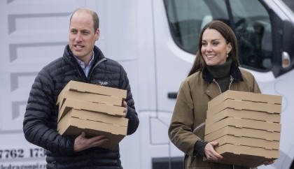 Prince William and Kate Middleton deliver pizzas to volunteers in Wales