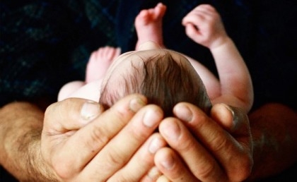 First baby with DNA from three people born in the UK