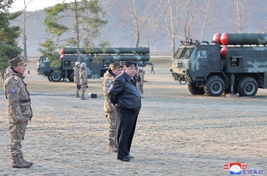 North Korea's Kim oversees 'super-large' rocket launcher drills