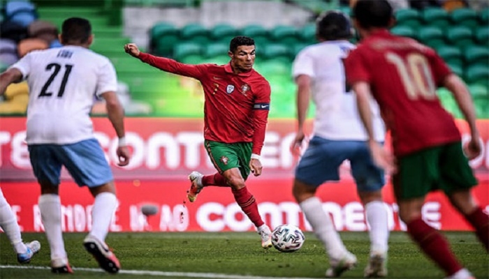 Lionel Messi and Cristiano Ronaldo greet each other warmly for the