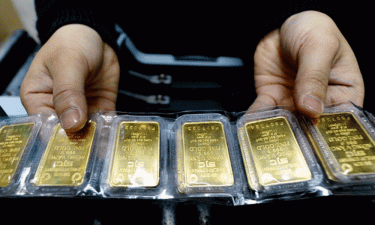 Gold prices cool near record peak as dollar holds ground