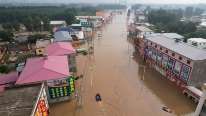 Streets become rivers as Beijing records heaviest rain in 140 years