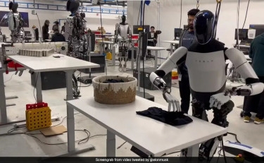 Elon Musk Shares Video Of Tesla's Optimus Robot Folding Shirts, But Issues Clarification Later